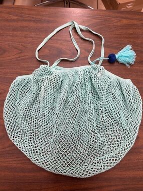 Preowned Mint Green Net Market Bag with Tassel with a small discoloration